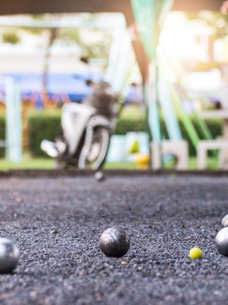 people at sport playing game petanque.